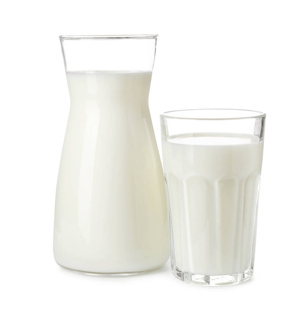 Glass and cruet with fresh milk on white background - Фото, зображення