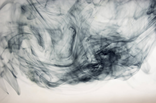 clouds of dark smoke over white background - Fotoğraf, Görsel