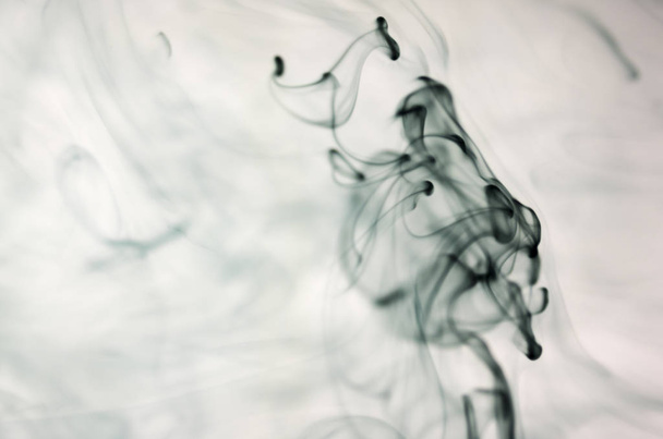clouds of dark smoke over white background - Foto, afbeelding