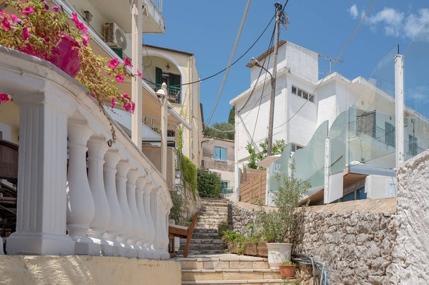 GREECE - CORFU - BENITSES - JULY 26, 2018: View of an alley in Benitses on Corfu in Greece. - Φωτογραφία, εικόνα