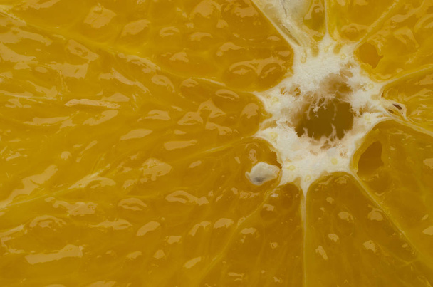 closeup view of juicy orange fruit slice background - Foto, Imagen