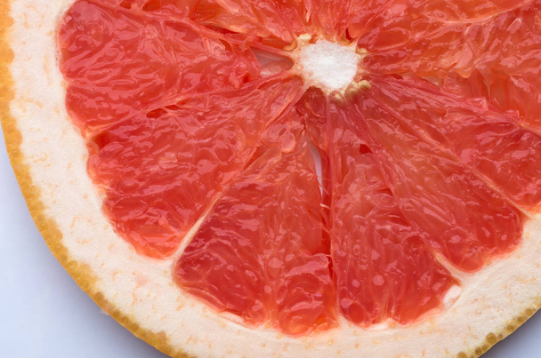 closeup view of grapefruit citrus fruit slice texture - Foto, Imagen