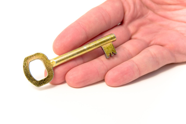 Рука и золотой ключ
 - Фото, изображение