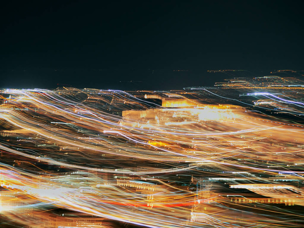 Blurred motion city light background.Abstract background with bokeh defocused lights. - Fotografie, Obrázek
