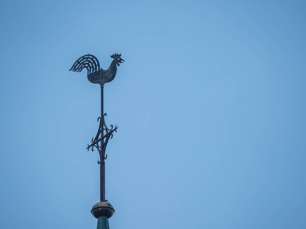 church spire with weathercock and blue sky without clouds - Foto, imagen