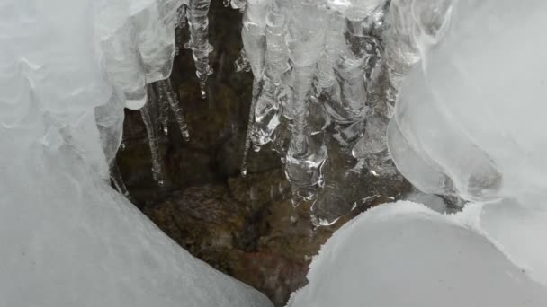 ice icicles flow melt water drop stones mountain cave - Footage, Video