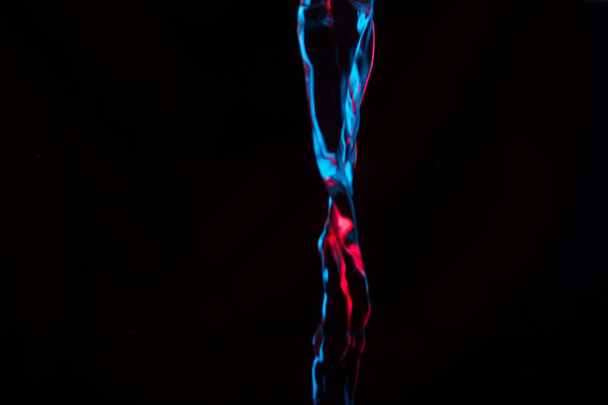 Red and blue neon background from water flow. defocused - Zdjęcie, obraz