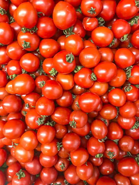 Vegetable background, texture, ripe red tomatoes in supermarket. Studio Photo - Photo, Image