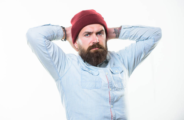 Man bearded with mustache brutal masculine appearance. Hipster style and fashion. Hipster bearded guy wear bright hat accessory. Bearded man posing confidently on white background. Barbershop concept - Foto, Imagem
