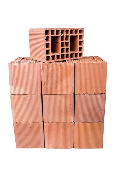 Stack of clay bricks isolated on white - Photo, Image
