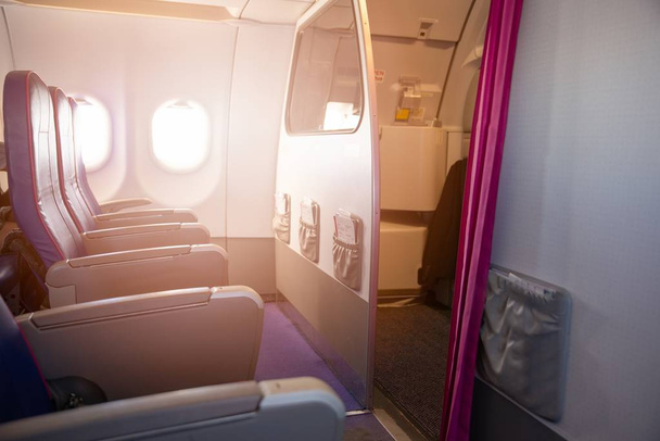 First row of seats in a passenger plane. Passenger plane interior, economy class - Photo, Image