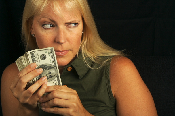 Стіні блондинка захищає свою готівку
 - Фото, зображення