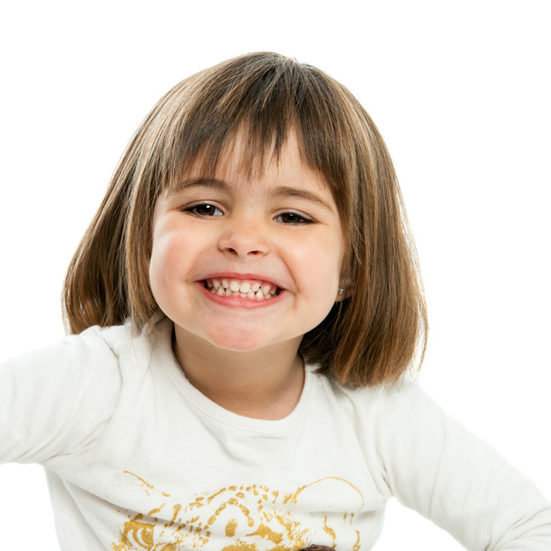 Douce fille montrant dents
. - Photo, image
