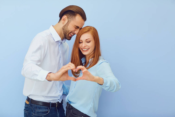Couple in love with a heart on a blue background.  - Photo, Image