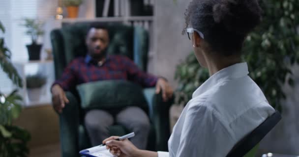 Young man talking to a psychologist - Footage, Video
