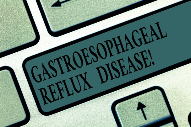 Word writing text Gastroesophageal Reflux Disease. Business concept for digestive disorder Burning chest pain Keyboard key Intention to create computer message pressing keypad idea. - Photo, Image