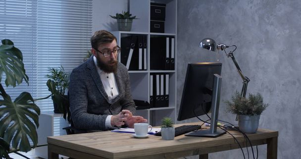 Psychologist video chatting at his desk - Fotoğraf, Görsel