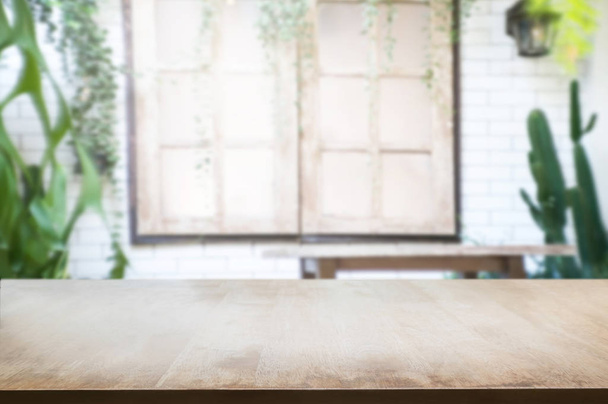 empty wooden table with blur restaurant background. - Photo, Image
