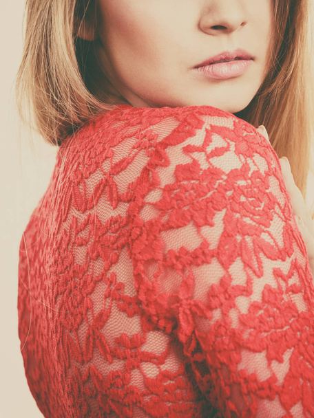 Elegant young woman wearing red lace top. Female presentig stylish fashionable outfit. - Foto, Bild