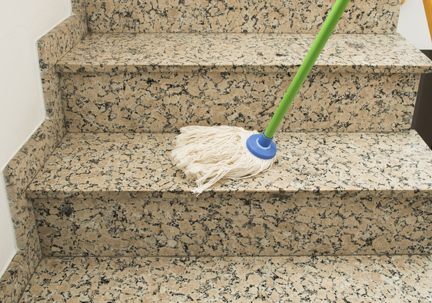 mop cleaning the stairs marble - Фото, зображення