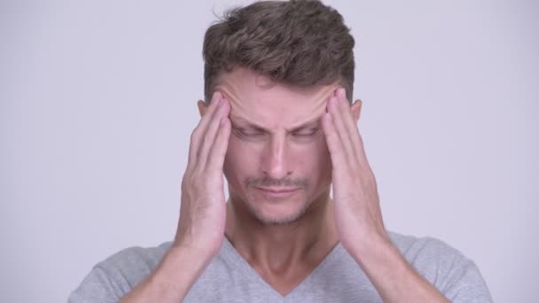Face of stressed bearded man having headache - Footage, Video