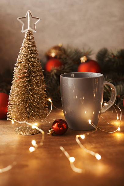 christmas decoration and cup with beverage on table - 写真・画像