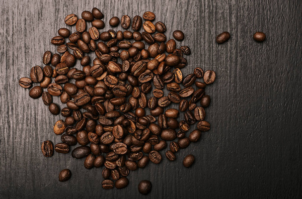top view of roasted organic aromatic coffee beans on table - Photo, Image