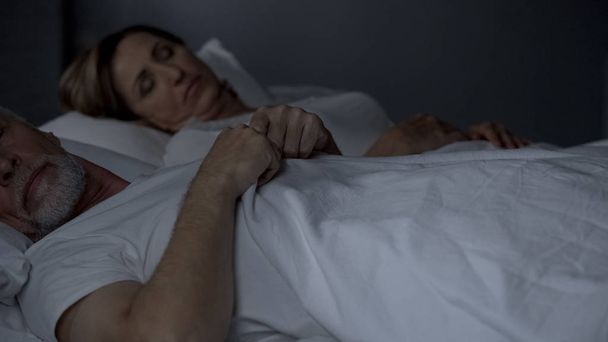 Elderly couple sleeping in bed, lack of emotions problems with potency menopause - Φωτογραφία, εικόνα
