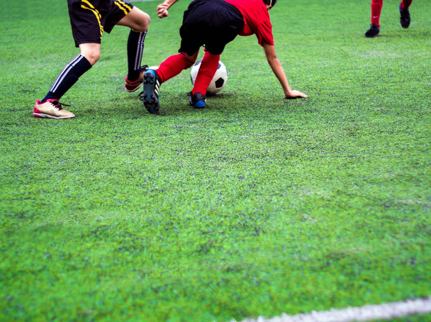 The footballers are competing in sports of elementary school - Фото, изображение