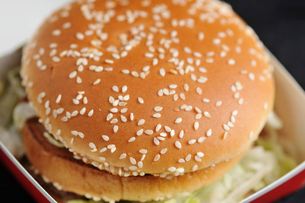 Burger with sesame bun close-up - Fotó, kép