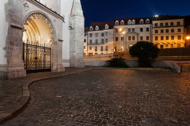 Slovakia, city of Bratislava at night, cobblestone square next to the Cathedral of St Martin. - Φωτογραφία, εικόνα