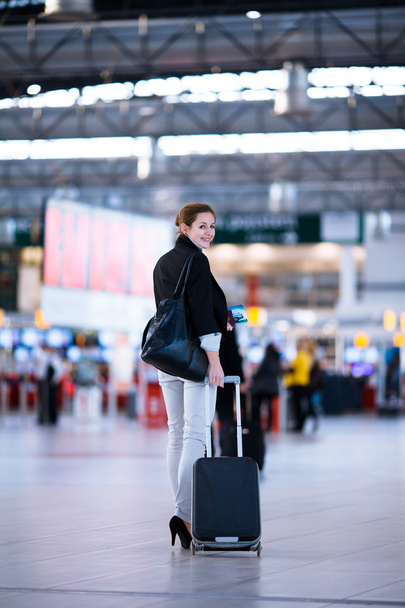 Pretty young female passenger at the airport - 写真・画像