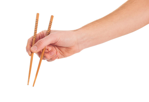 Close-up Of Hand Holding Chopsticks - Foto, imagen