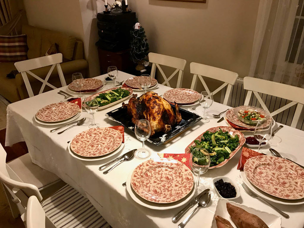 Homemade Roasted Thanksgiving Day Turkey with all the Sides at Dinner Table. Organic Traditional Food. - Фото, изображение