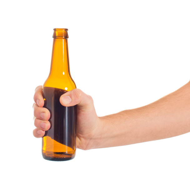 Close-up Of Hand Holding Empty Beer Bottle - Foto, Imagen