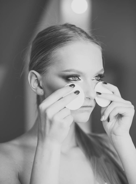 Look of pretty woman correct makeup. Look, woman use cotton pad for cleaning face skin. - Fotoğraf, Görsel