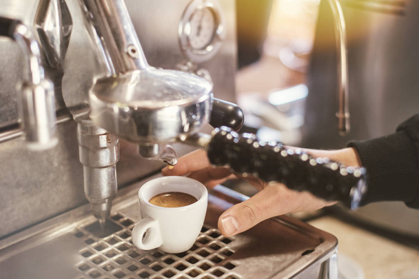 Proffessional brewing - coffee bar details. Espresso coffee pouring from espresso machine. - Φωτογραφία, εικόνα