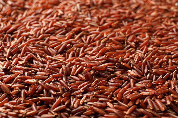 Raw brown rice as background, closeup view - Фото, зображення