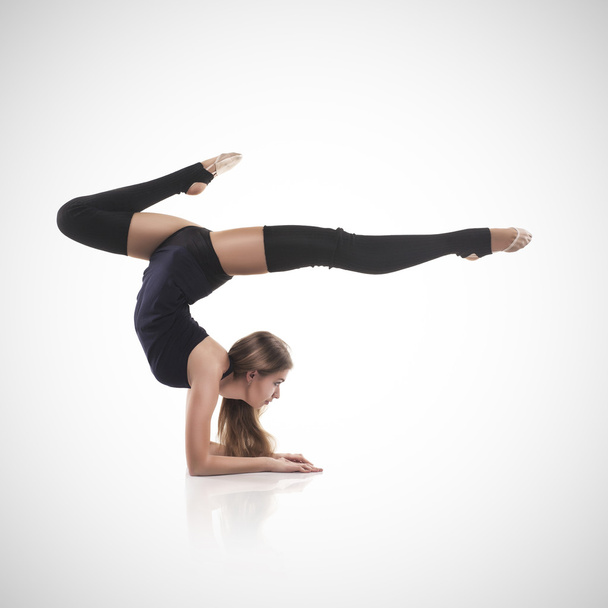 Woman in the gymnastic pose - Фото, зображення