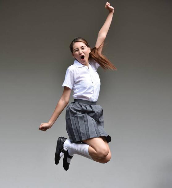 Excited Female Teenager Jumping - Valokuva, kuva