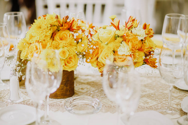 love table setup, wedding guest table, reception layout rustic and vintage background in color yellow - Photo, Image