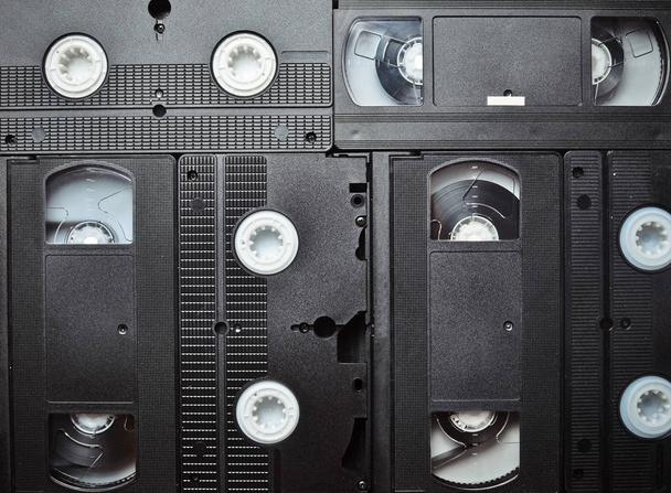 Hintergrund vieler Videokassetten. Technologie der Vergangenheit. Raum für Text. - Foto, Bild