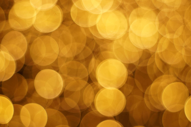 The golden bokeh blurred abstract pattern background. - Foto, Imagem