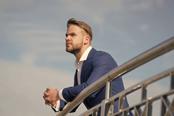 Businessman on blue sky. Manager in business suit outdoor. Bearded man on sunny day. Business fashion, style and dress code. Career, success and future concept - Foto, afbeelding