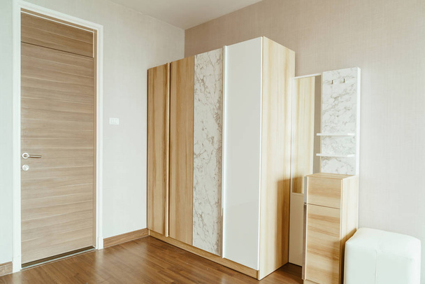 beautiful wooden wardrobe in a room - Φωτογραφία, εικόνα