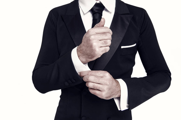Hand fix white shirt sleeve cuff with cufflink - Фото, изображение