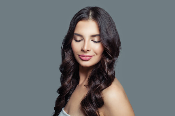 Young smiling woman with long healthy hair and natural makeup. Hair care and beauty salon background - Fotoğraf, Görsel