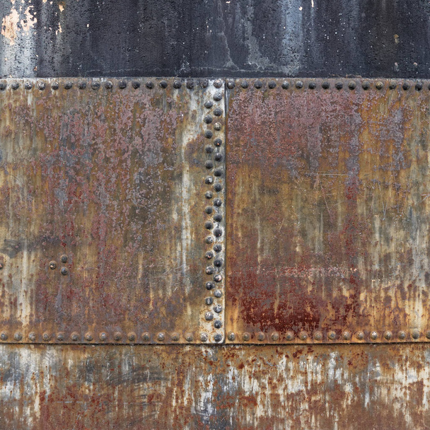 rusty metallic surface with bolt heads - Fotoğraf, Görsel