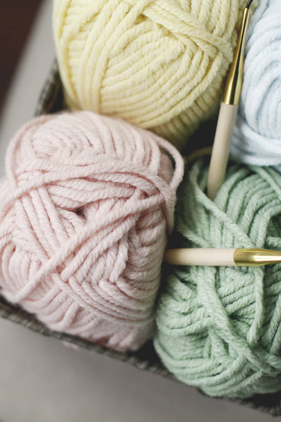 Strings for yarn with needles, closeup on grey sofa - Fotoğraf, Görsel