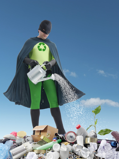 Eco superhero and green plantlet - Photo, Image